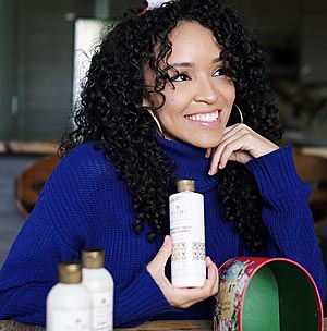 woman with beautiful hair in blue sweater